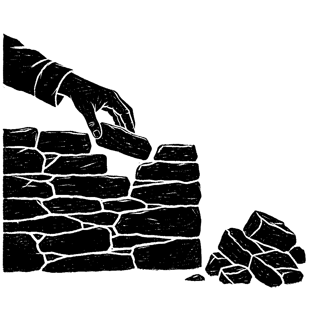 A hand placing a single stone into a gap in a dry stone wall, with a pile of loose stones next to it.