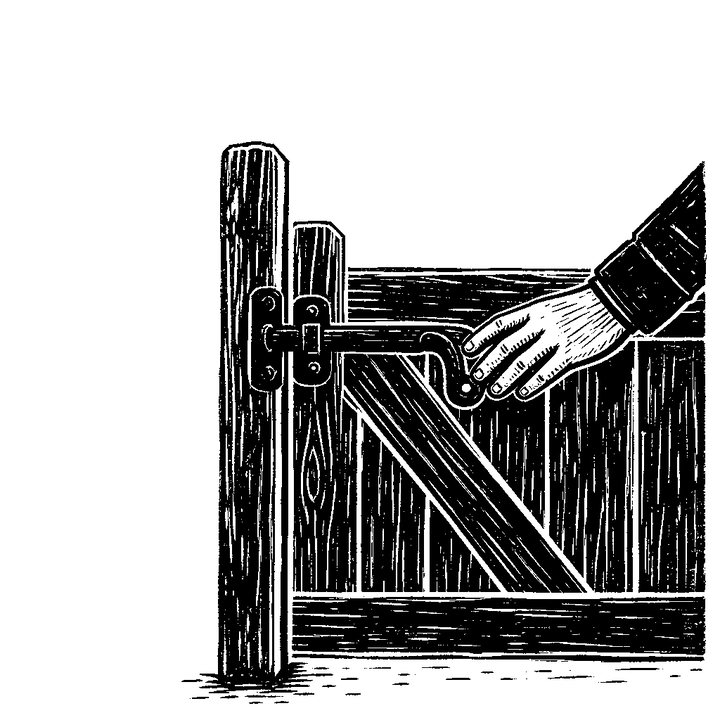 A hand on the heavy latch of a wooden gate closed across a path.